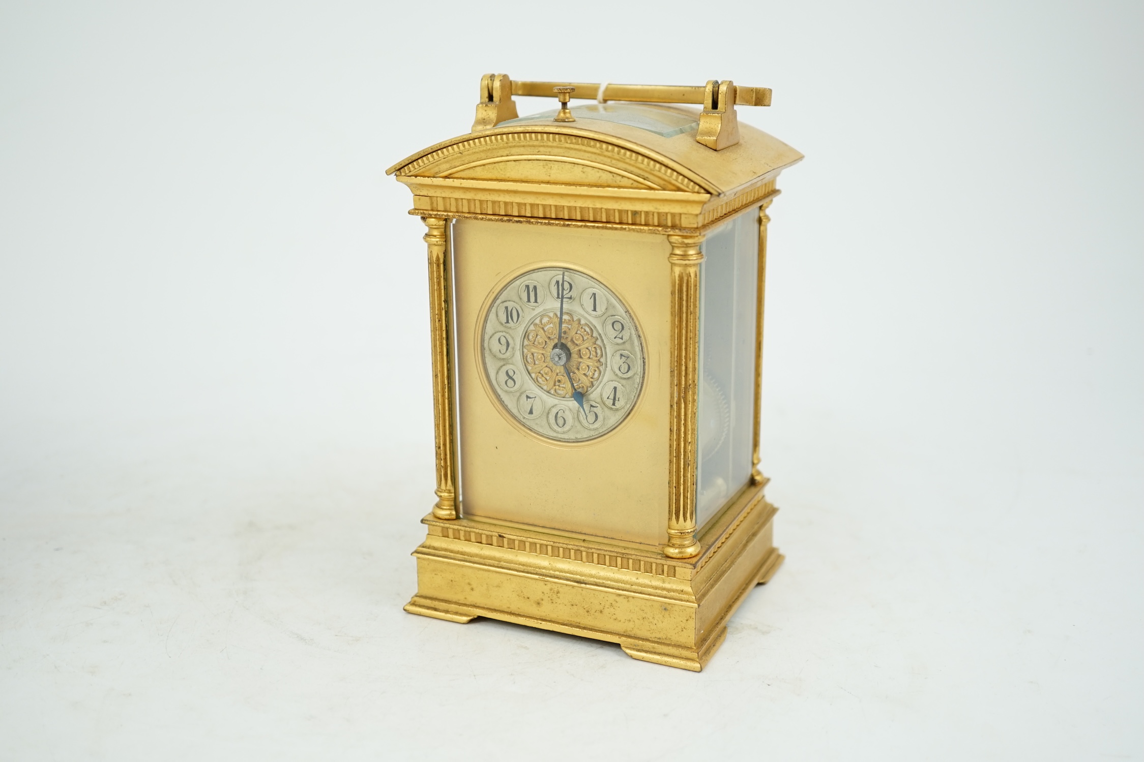 An early 20th century French ormolu hour repeating carriage clock